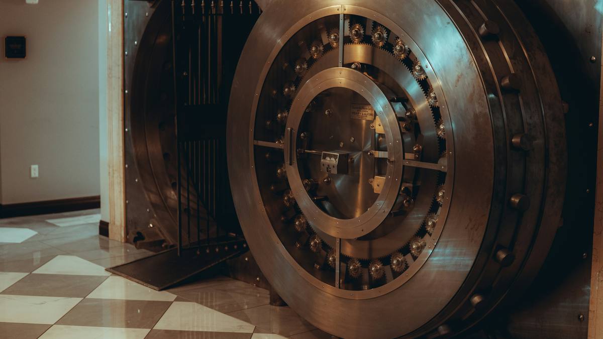 A heavy round bank vault door