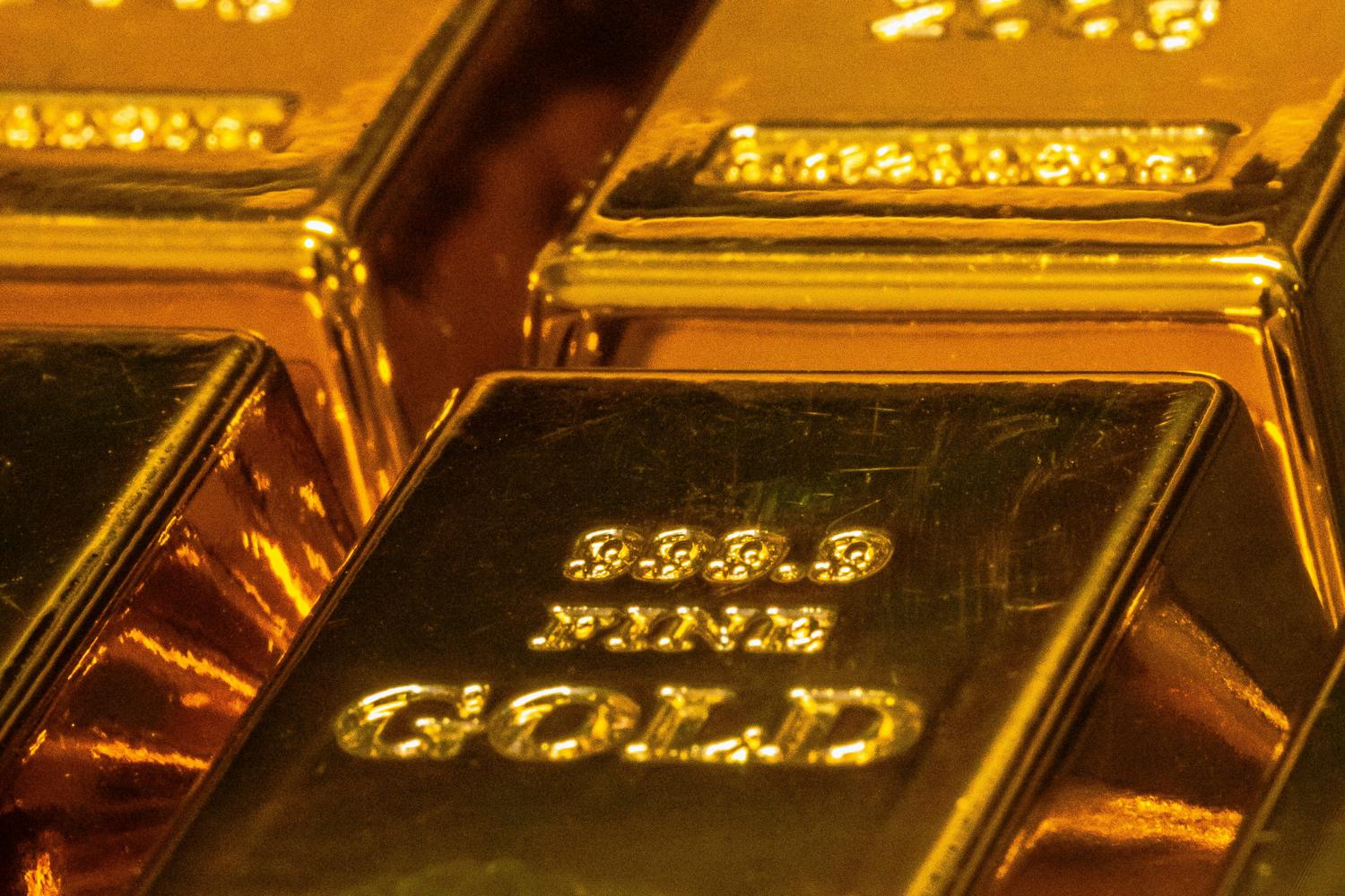 Stacked gold bars stamped 999.9 fine gold